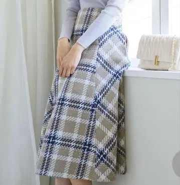 노엘라 울 혼방 체크 무늬 플레어 스커트