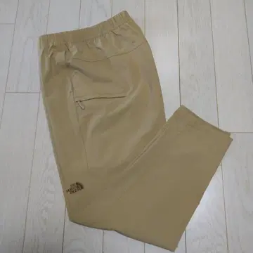 베이지 조거 팬츠 지퍼 포켓 부착