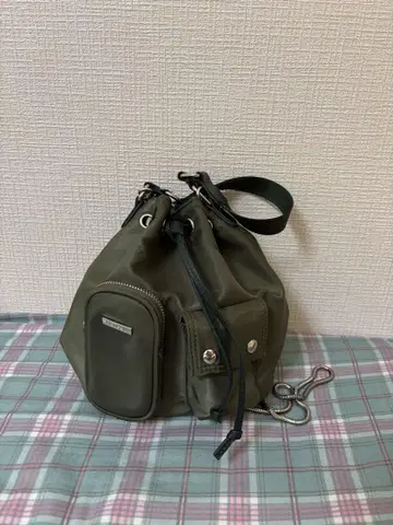 MOUSSY LOGO STRAP BUCKET BAG