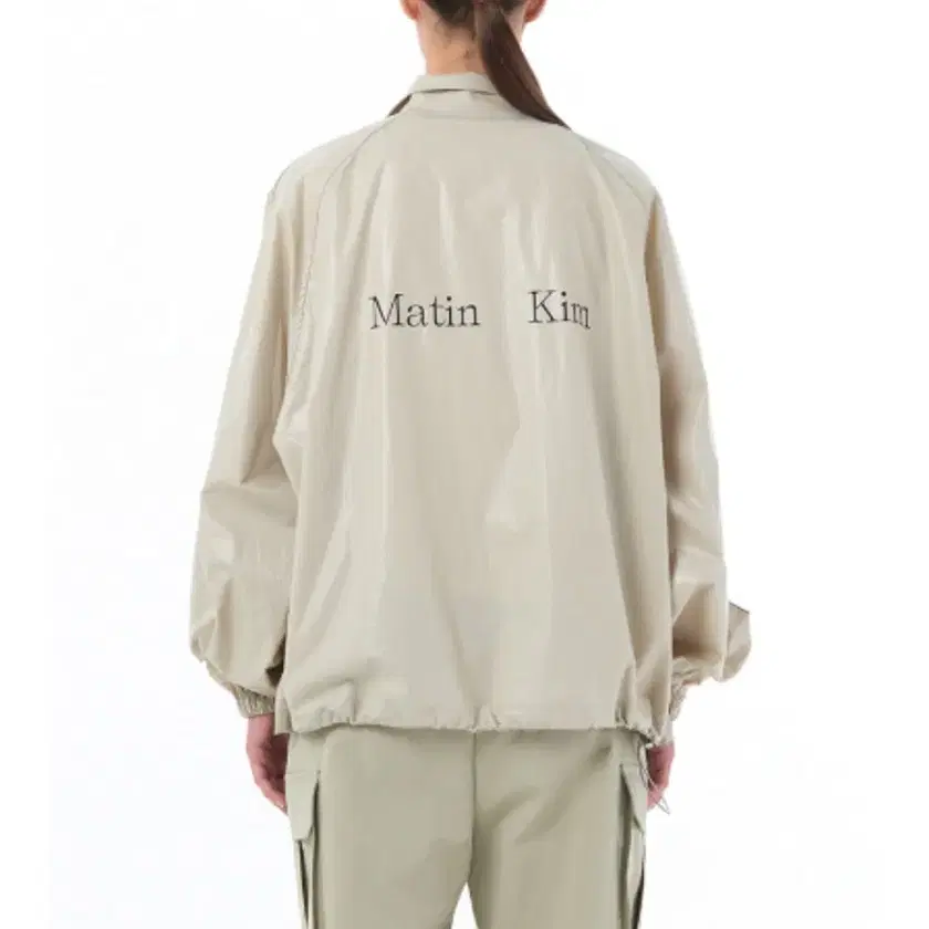 MATIN KIM | 마뗑킴 Matin Kim Logo Coating Jumper_Beige F on
