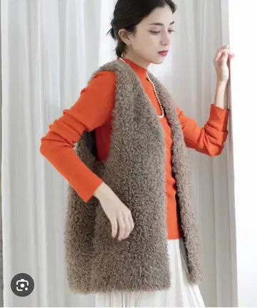 컬리 인조 모피 베스트