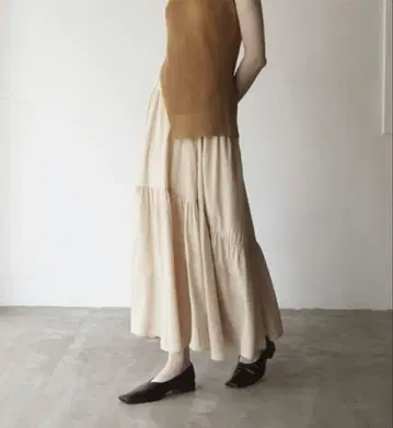 CLANE 베이지 티어드 플레어 스커트