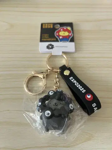 간사이 박람회 블랙 미야쿠미야쿠 키링 폼폼푸딩 산리오