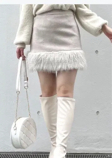 NOMAE 밑단 퍼 사다리꼴 스커트