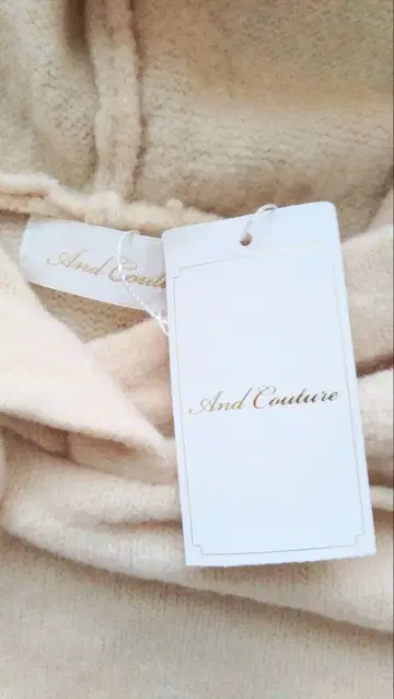 And Couture 아이보리 후드 부착 니트