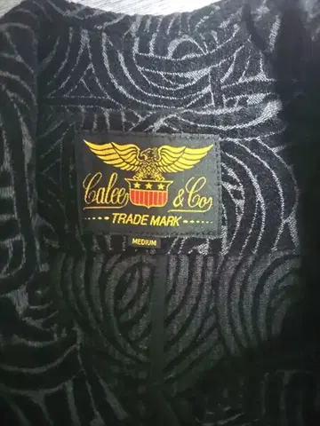 가격 인하 새상품급 레어 CALEE 코트 블랙 올 패턴 스파이럴 패턴 M