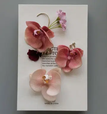 sassy. flower ear cuffs