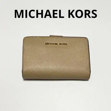 마이클코어스 3단 폴더형 지갑 베이지 계열 골드 금장 장식 컴팩트 지갑