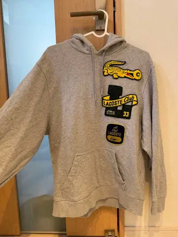 LACOSTE 헤리티지 와펜 후드티