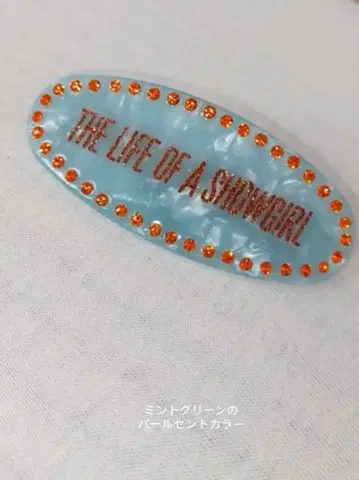 THE LIFE OF A SHOWGIRL 로고 머리핀