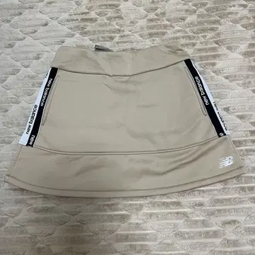 new balance 여성용 골프 스커트 베이지