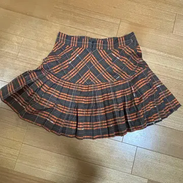 오렌지와 그레이 체크 무늬 플리츠 스커트