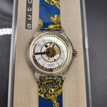 Swatch 자동 시계 파랑/금