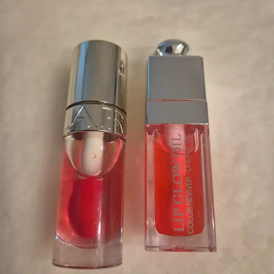 Dior Lip Glow Oil Cherry / Clarins Lip Oil Pitaya