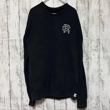 REIGNING CHAMP 론 헤르만 블랙 맨투맨 M