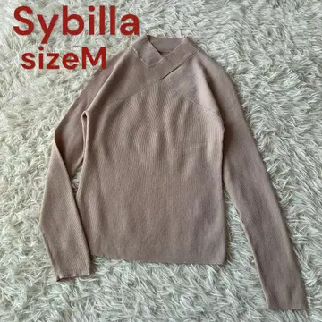 새상품급 시빌라 목 부분이 크로스 디자인인 베이지 리브 니트 모 100%