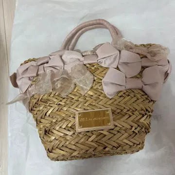 질 바이 질 스튜어트 리본 장식 스트로우 바스켓백