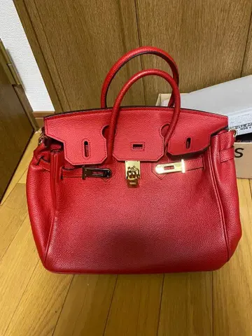 가죽제 레드 핸드백