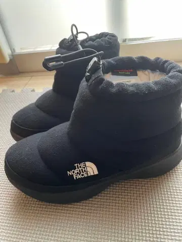 THE NORTH FACE 눕시 부티 숏 울