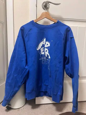 ADER 그래픽 프린트 트레이닝복