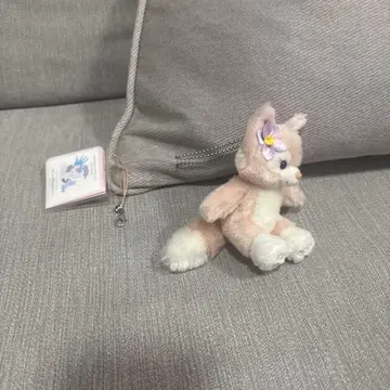 꽃 장식이 달린 고양이 봉제 인형