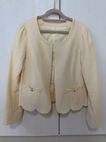 크림색 노카라 자켓