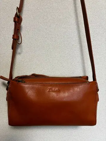 다코타 렉스 카멜 숄더백