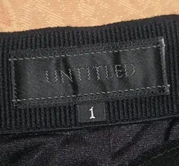 UNITED 무릎 기장 타이트 스커트