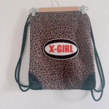 X-GIRL 오벌 로고 메쉬 냅색