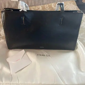 스탠드 오일 숄더백 블랙