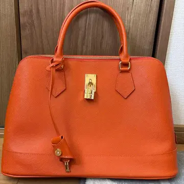 오렌지 핸드백 금장 장식 포함