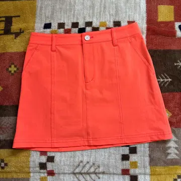 오렌지 스커트 앞 버튼 포함