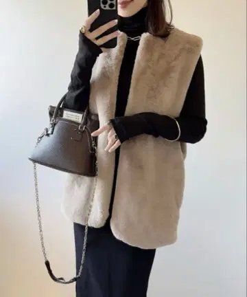 andme 인조 모피 베스트