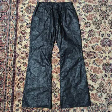 A PUZZLING HOME COATING BOOTS CUT PANTS