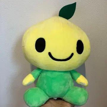 미소 짓는 캐릭터 봉제 인형 높이 약 23cm