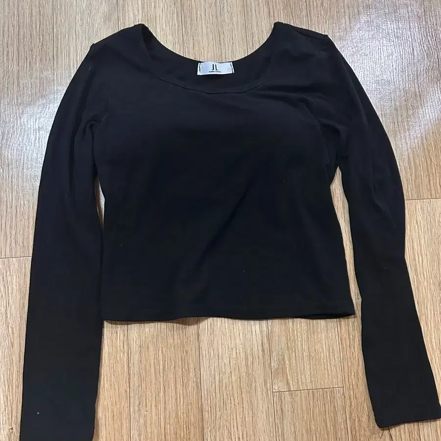 Black long-sleeved t-shirt with built-in cap