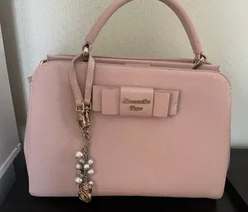 리본 포함 핑크 핸드백