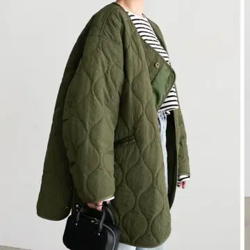 SNORDREL 스노우드렐 ASYMMETRY QUILTED COAT