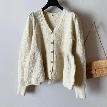 펄 버튼*라메 니트 밑단 프릴 가디건