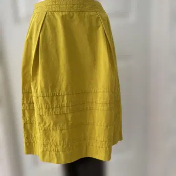 NUEVIS의 무릎 기장 스커트