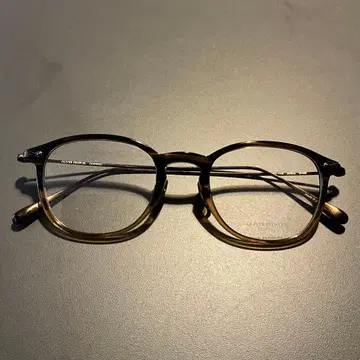 OLIVER PEOPLES 브라운 라운드 프레임 안경