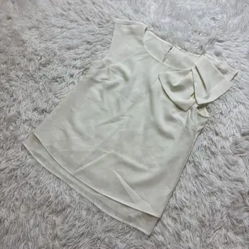 JUSGLITTY 슬리브리스 블라우스 시어 블라우스