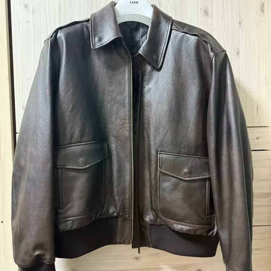 COOR | 쿠어 Coors Waxed Cotton Washed Deck Bomber in Dark Grassy