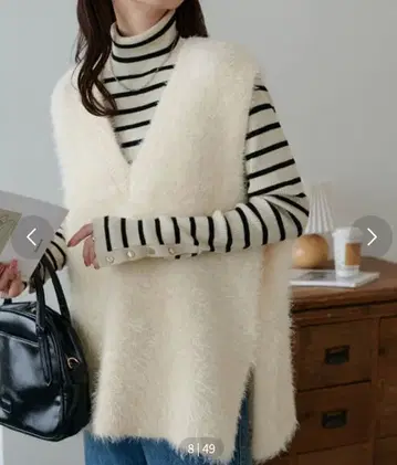 새상품 디스코트 라이트 페더 얀 튜닉 베스트 아이보리