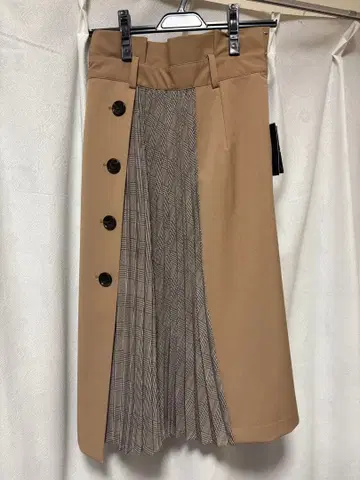JUSGLITTY 베이지 스커트