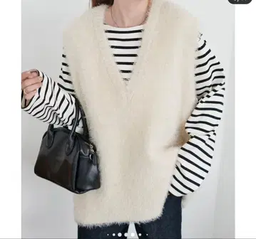 DISCOAT 페더얀 튜닉 베스트