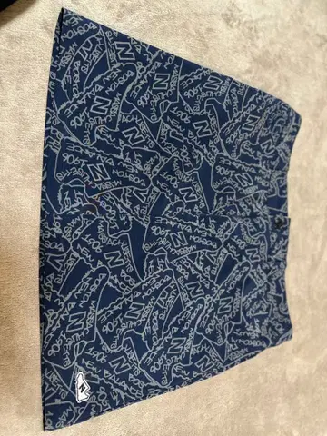 네이비 로고 패턴 스커트 뉴발란스