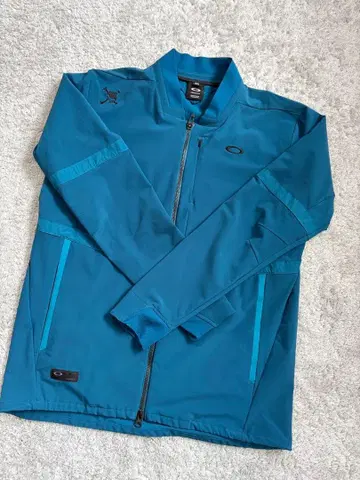 Oakley 파랑 자켓 Ferrari 로고 포함