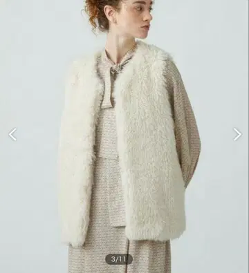 투모로우랜드 볼지 푸들 퍼 크루넥 베스트