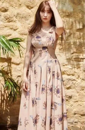 Her lip to sunflower-printed midi dress